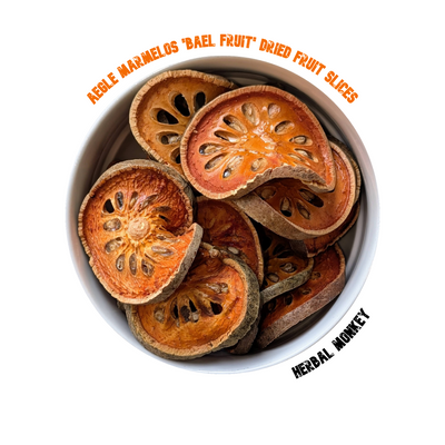 Dried Bael Fruit slices and a warm amber‑coloured bael tea, traditionally brewed as Thai Nam Matoom