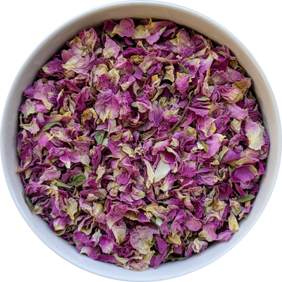 Loose dried rose petals for floral infusion and heart ritual preparation