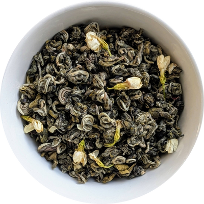Loose jasmine flower green tea — dried jasmine blossoms blended with fragrant green tea leaves
