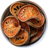 Dried Bael Fruit slices and a warm amber‑coloured bael tea, traditionally brewed as Thai Nam Matoom Herbal Monkey