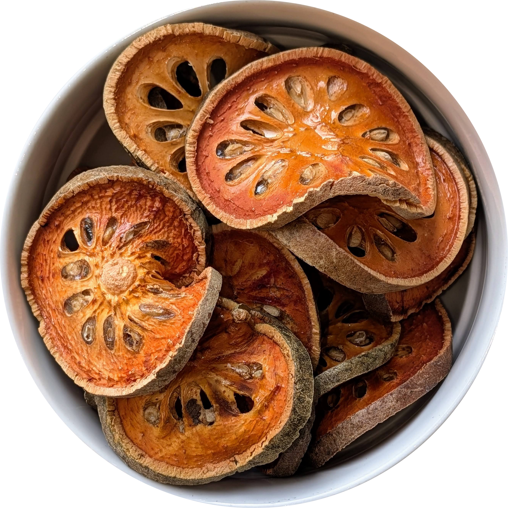 Dried Bael Fruit slices and a warm amber‑coloured bael tea, traditionally brewed as Thai Nam Matoom Herbal Monkey